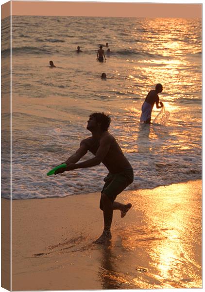 Frisbee Thrower on Varkala Beach at Sunset Canvas Print by Serena Bowles