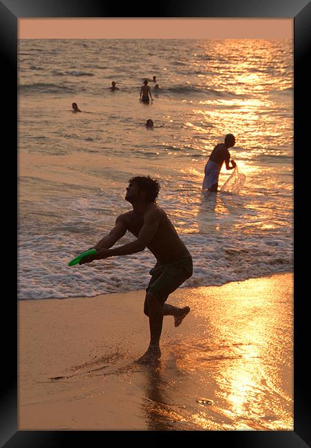 Frisbee Thrower on Varkala Beach at Sunset Framed Print by Serena Bowles