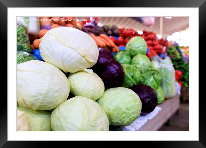 White cabbage heads against the background of various other varieties in blur. Framed Mounted Print by Sergii Petruk