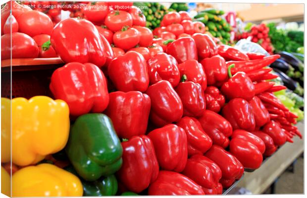 Multicolored sweet peppers, tomatoes, cucumbers, eggplants and other vegetables sold on the market Canvas Print by Sergii Petruk