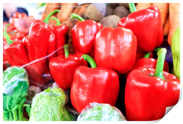 Large red sweet bell peppers on the background of other vegetables sold on the market Print by Sergii Petruk