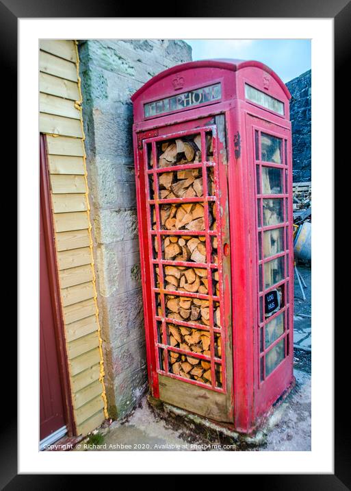 Red telephone box store in Lerwick Shetland Framed Mounted Print by Richard Ashbee