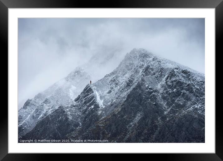 Stunning detail landscape images of snowcapped Pen Yr Ole Wen mountain in Snowdonia during dramatic moody Winter storm Framed Mounted Print by Matthew Gibson