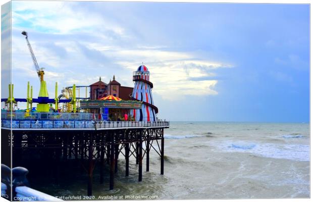 Fun at Brighton Pier Helter Skelter Canvas Print by Julie Tattersfield