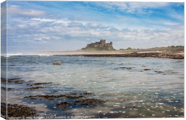 Cinematic Bamburgh Castle by the Shoreline Canvas Print by Holly Burgess