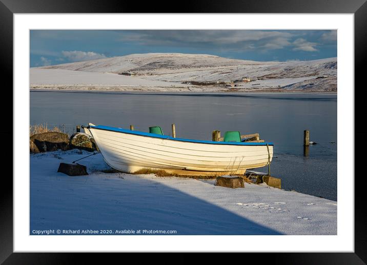 Shetland small white fishing boat in snow at Tingw Framed Mounted Print by Richard Ashbee