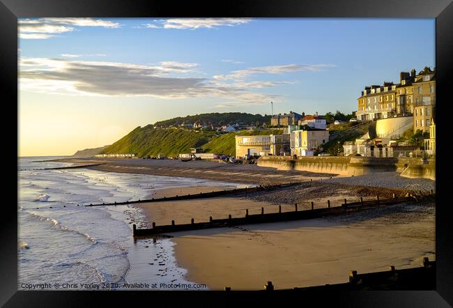 A view across Cromer beach at sunrise from the pier Framed Print by Chris Yaxley