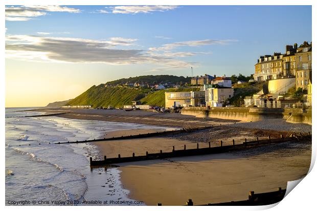 A view across Cromer beach at sunrise from the pier Print by Chris Yaxley