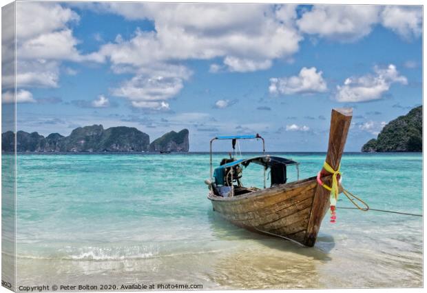 Long tail boat on the beach at Ko Phi Phi Leh, Krabi Province, Thailand. Canvas Print by Peter Bolton
