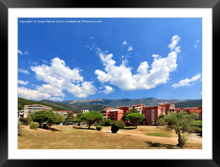 In the colorful urban valley of Montenegro white clouds float across the sky. Framed Mounted Print by Sergii Petruk