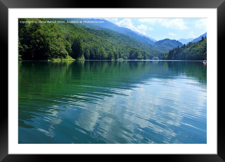 Reflection of white clouds in the smooth surface of a forest mountain lake Framed Mounted Print by Sergii Petruk