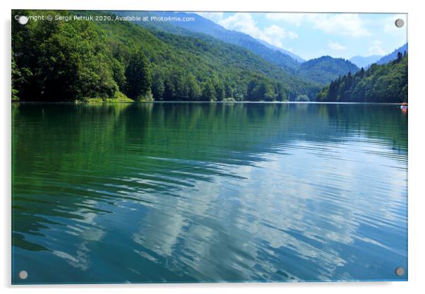 Reflection of white clouds in the smooth surface of a forest mountain lake Acrylic by Sergii Petruk