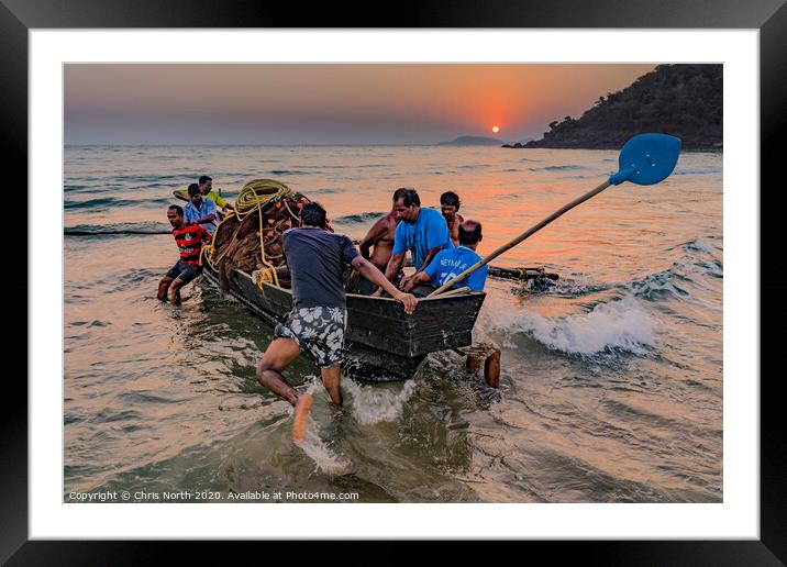 Goa, fisherman launching boat at sunset. Framed Mounted Print by Chris North