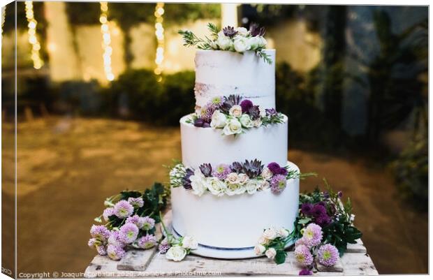 Pretty three-tier wedding cake decorated for a wedding event. Canvas Print by Joaquin Corbalan