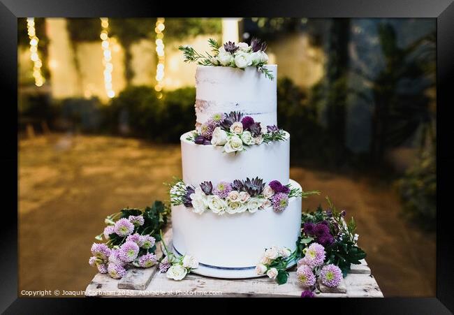 Pretty three-tier wedding cake decorated for a wedding event. Framed Print by Joaquin Corbalan