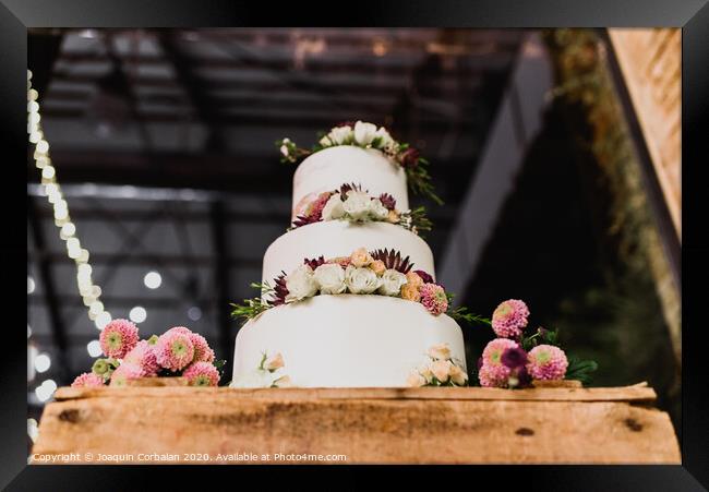Pretty three-tier wedding cake decorated for a wedding event. Framed Print by Joaquin Corbalan