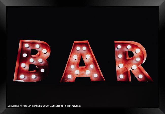 Bar written with luminous bulbs on a dark black background. Framed Print by Joaquin Corbalan