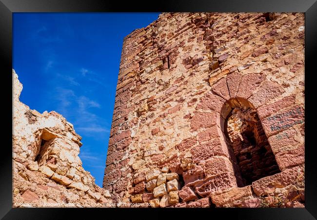 Walls of an old abandoned European castle with blue sky background. Framed Print by Joaquin Corbalan