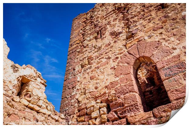 Walls of an old abandoned European castle with blue sky background. Print by Joaquin Corbalan