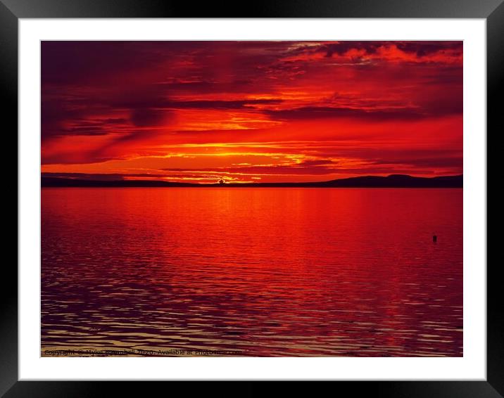Dramatic red sunset over Orkney  Framed Mounted Print by Myles Campbell