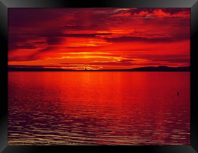 Dramatic red sunset over Orkney  Framed Print by Myles Campbell