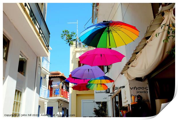 Colorful Parasols hanging in street at Skiathos Town in Greece.  Print by john hill