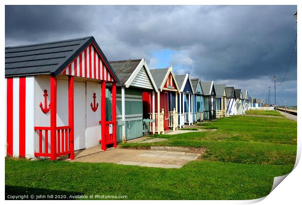 Stormy skies over beach huts in Lincolnshire. Print by john hill