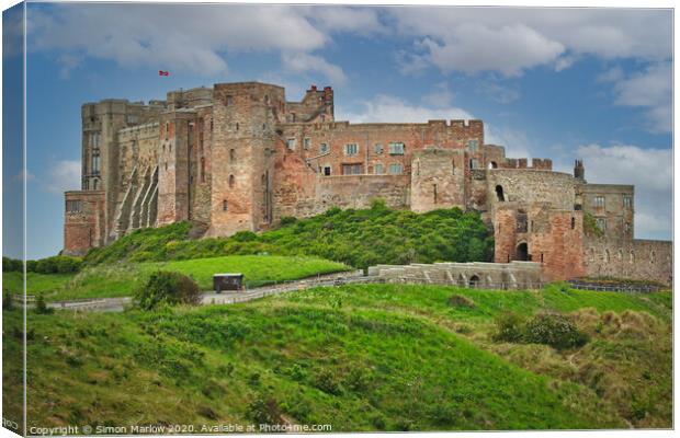 Bamburgh Castle in Northumberland Canvas Print by Simon Marlow