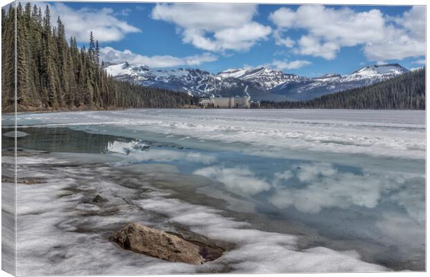 Reflections in a Partially Thawed Lake Louise Canvas Print by Belinda Greb