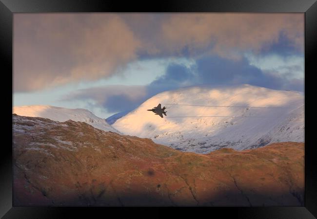 RAF Fighter Plane over the Langdale Pike in the La Framed Print by MIKE HUTTON