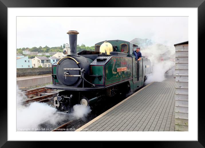 Steam engine blowing off steam at Festiniog railway station at Porthmadog in Wlaes. Framed Mounted Print by john hill