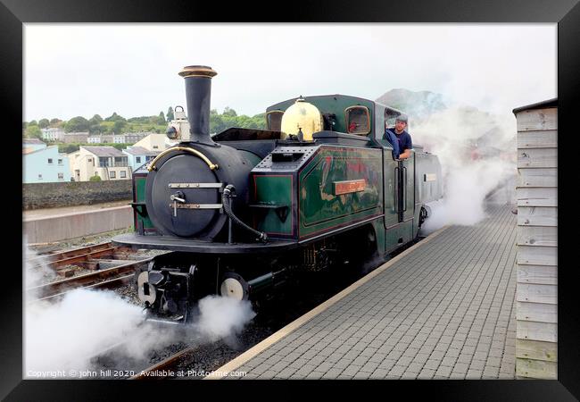 Steam engine blowing off steam at Festiniog railway station at Porthmadog in Wlaes. Framed Print by john hill