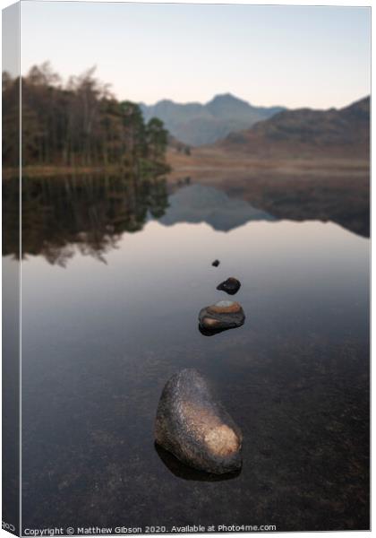 Beautiful Autumn Fall colorful sunrise over Blea Tarn in the Lake District with High Raise and The Langdales in the distance Canvas Print by Matthew Gibson