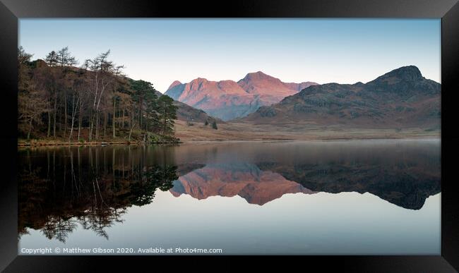 Beautiful Autumn Fall colorful sunrise over Blea Tarn in the Lake District with High Raise and The Langdales in the distance Framed Print by Matthew Gibson
