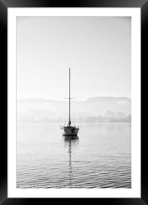 Stunning unplugged fine art landscape image of sailing yacht sitting still in calm lake water in Lake District during peaceful misty Autumn Fall sunrise Framed Mounted Print by Matthew Gibson