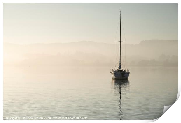 Stunning unplugged fine art landscape image of sailing yacht sitting still in calm lake water in Lake District during peaceful misty Autumn Fall sunrise Print by Matthew Gibson