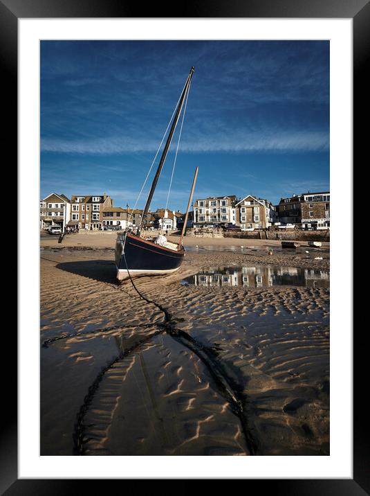 Fishing boat catching the early morning light in St Ives harbour, Cornwall Framed Mounted Print by Dan Ward