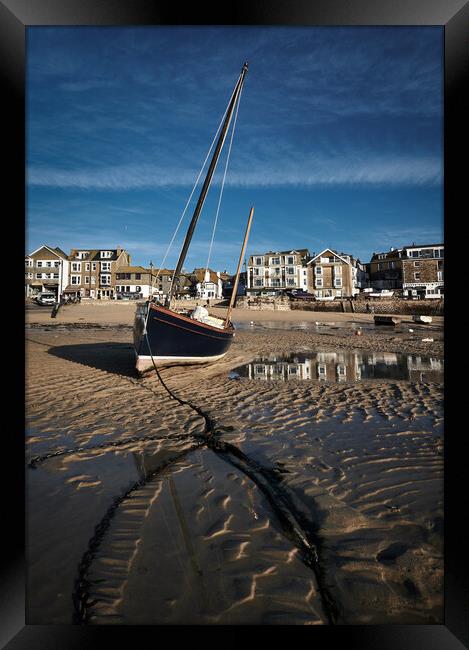 Fishing boat catching the early morning light in St Ives harbour, Cornwall Framed Print by Dan Ward