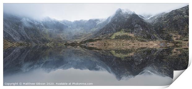 Beautiful moody Winter landscape image of Llyn Idwal and snowcapped Glyders Mountain Range in Snowdonia Print by Matthew Gibson