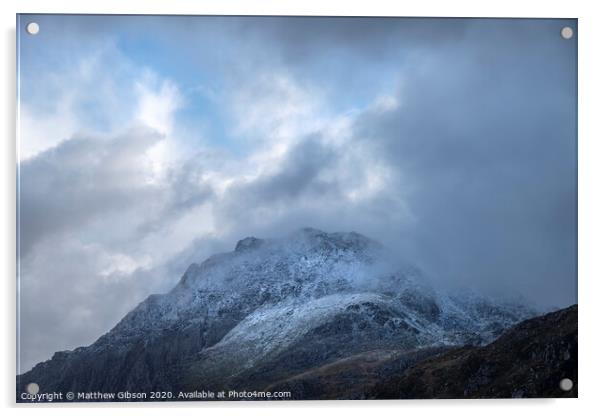 Stunning moody dramatic Winter landscape image of snowcapped Tryfan mountain in Snowdonia with stormy weather brooding overhead Acrylic by Matthew Gibson