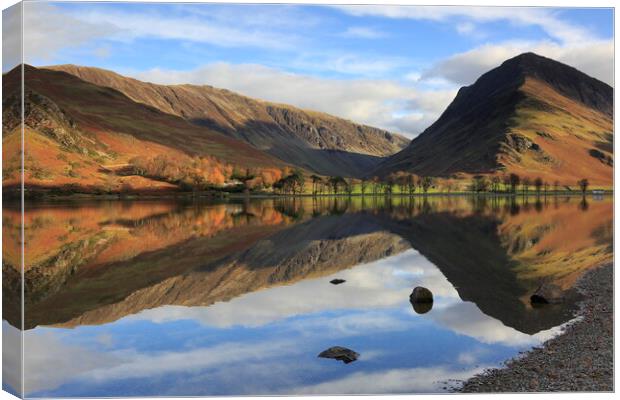 Lake Buttermere reflection in the Lake District Canvas Print by MIKE HUTTON