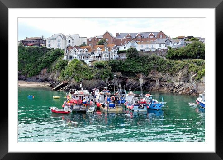 Fishing boats moored in the harbour at Newquay in Cornwall. Framed Mounted Print by john hill