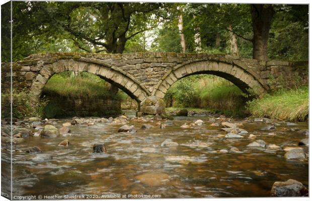 Wycoller Packhorse Bridge and Beck Canvas Print by Heather Sheldrick