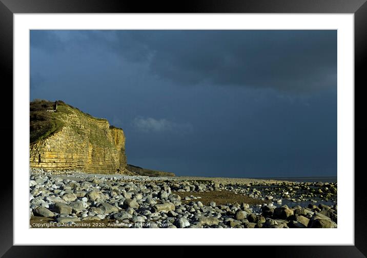 Llantwit Major Beach on a dark sky Winter evening Framed Mounted Print by Nick Jenkins