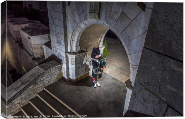 Regimental piper at the War Memorial in Gibraltar. Canvas Print by Chris North