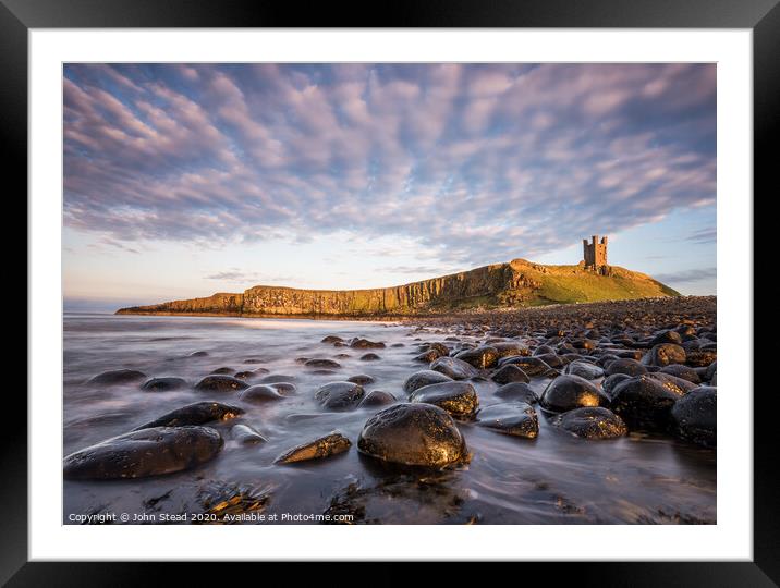 Dunstanburgh Castle clouds Framed Mounted Print by Northern Wild