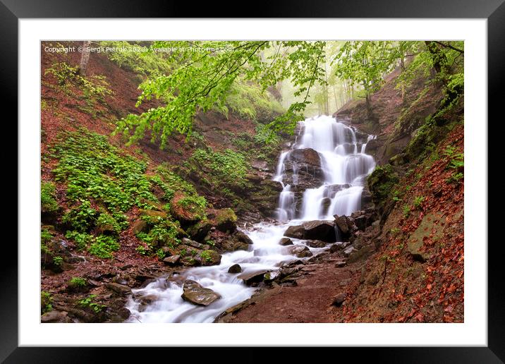 Beautiful and picturesque waterfall on a mountain river in the Carpathian forest in Ukraine. Framed Mounted Print by Sergii Petruk