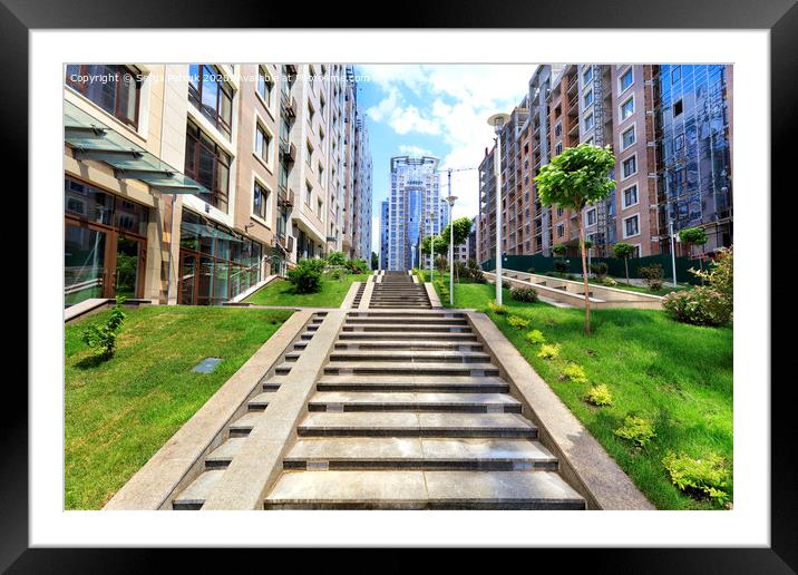 The steps of the granite stairs rise up the slope of the city street. Framed Mounted Print by Sergii Petruk
