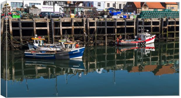 Reflections of fishing boats Canvas Print by Jason Wells