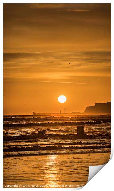 Sunrise over Whitby viewed from Sandsend. Print by Chris North